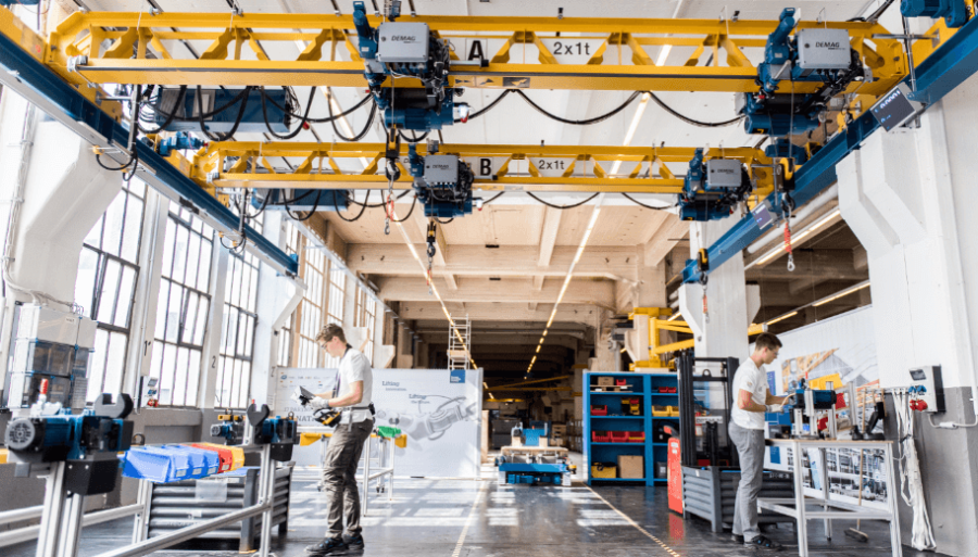 5G Performance Evolution for Material Handling in Manufacturing
